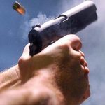 Gun in hand image