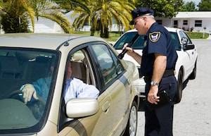 Policeman stopping car image